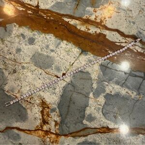 White gold plated cz diamond tennis bracelet measures 6.5 inches